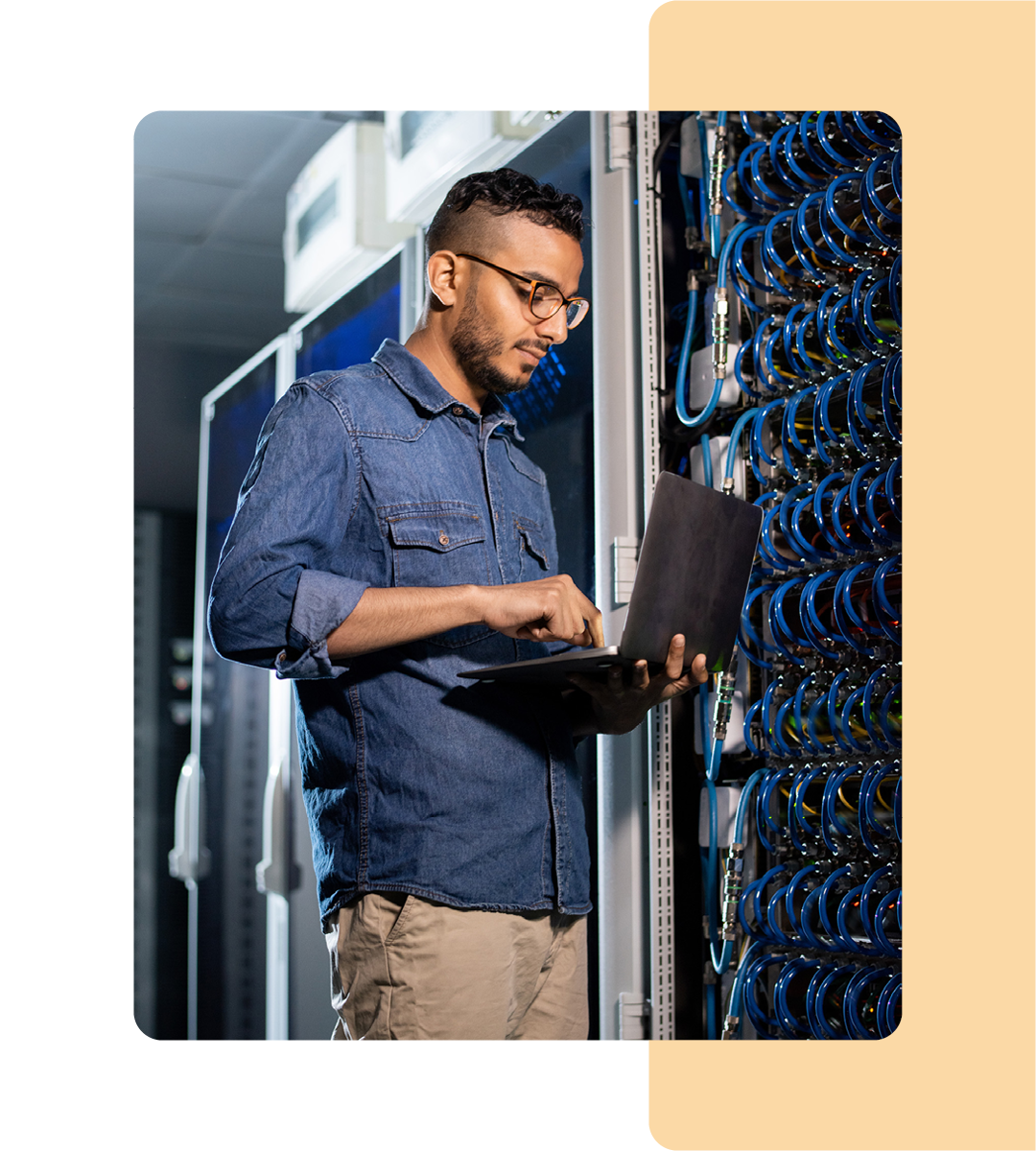 Image of an IT professional working in a server room