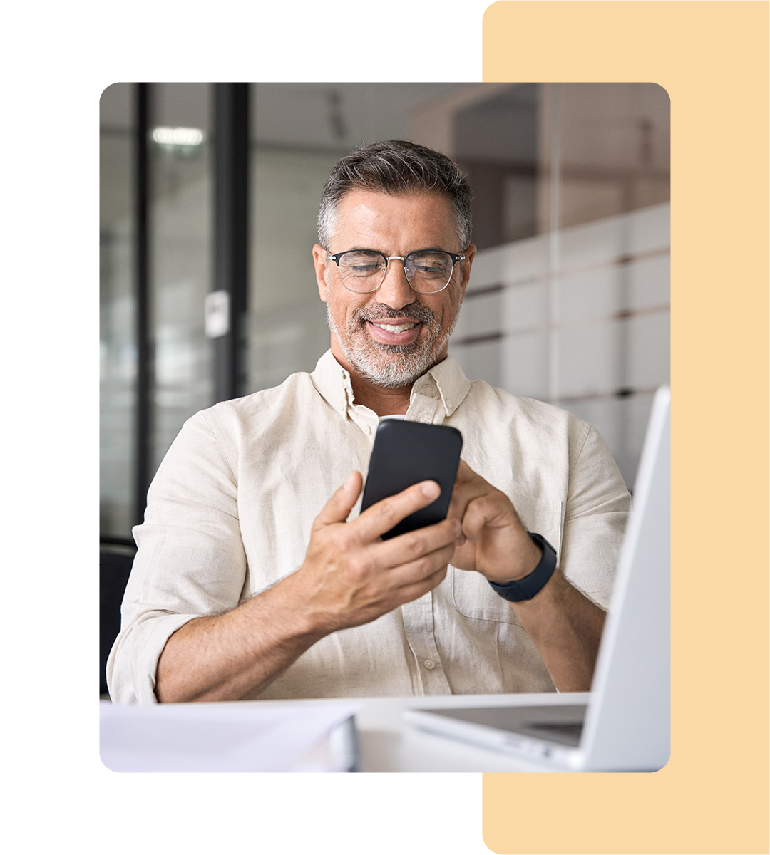 Image of a business professional on their mobile phone in an office environment