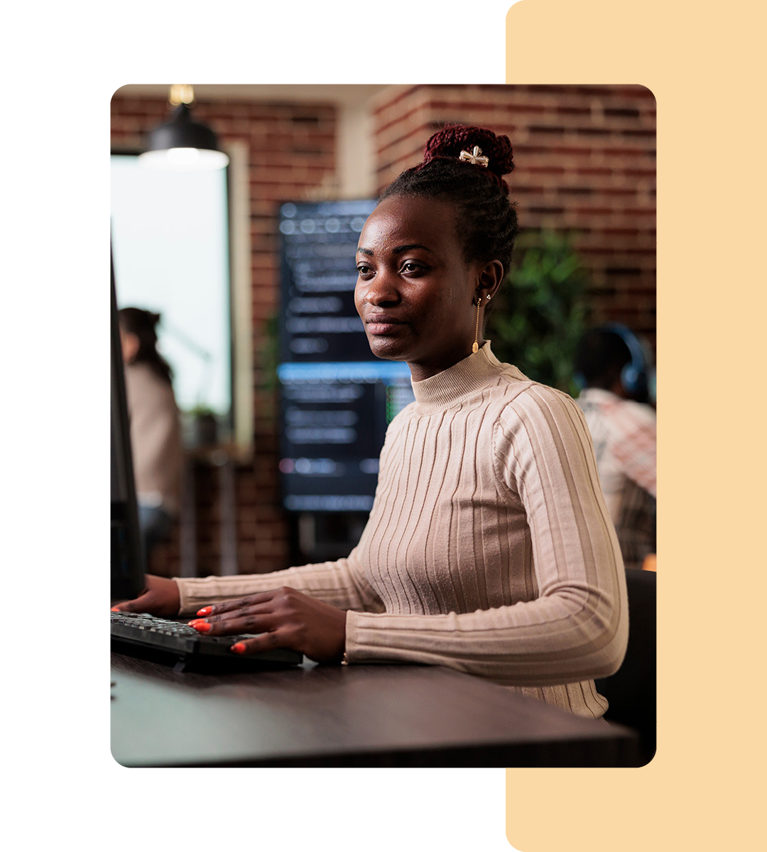 Image of an IT professional working at a desk