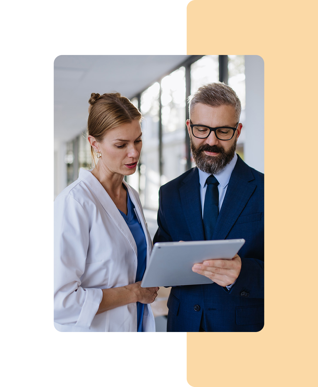 Image of two doctors analysing information on a clipboard