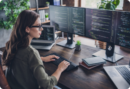 Image of an IT professional working on a computer