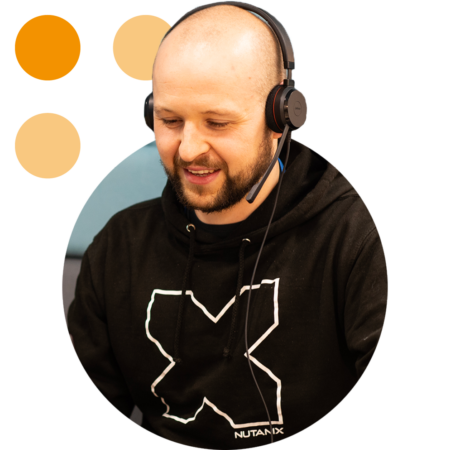 Image of a smiling Phoenix Software employee talking on a headset