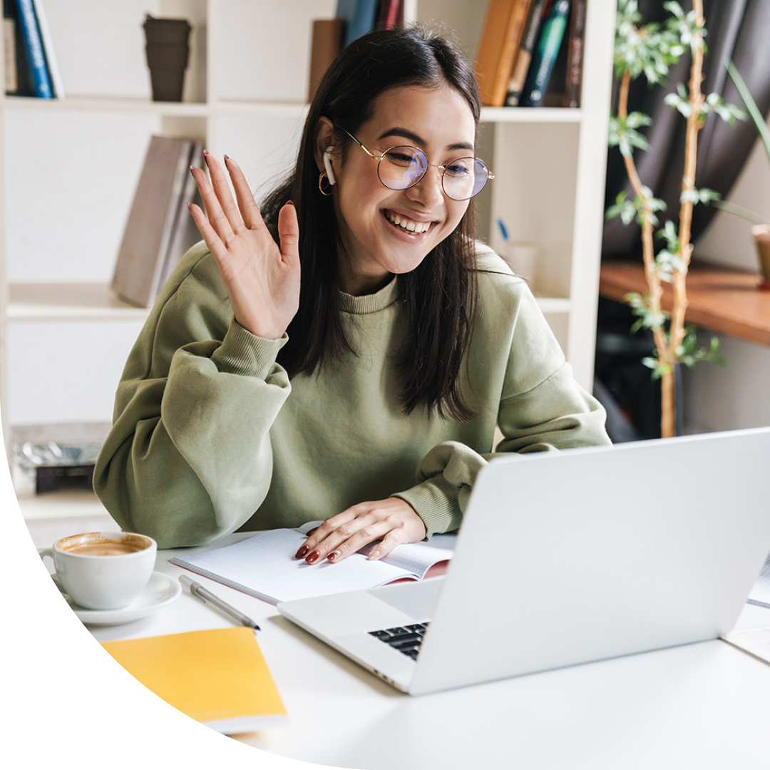 Image of a smiling university student talking on a virtual call