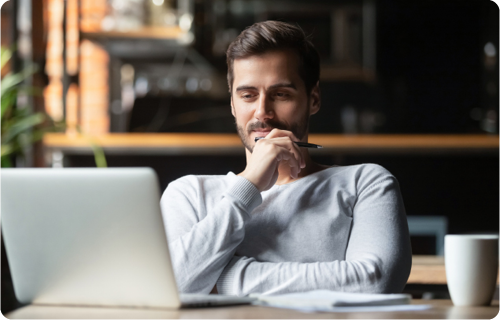 man working from home focused on his laptop relaxed