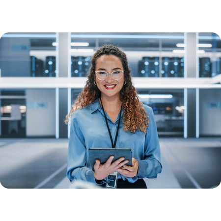 business person holding tablet in modern office smiling at camera