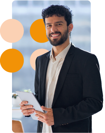 business man in suit holding tablet smiling at camera