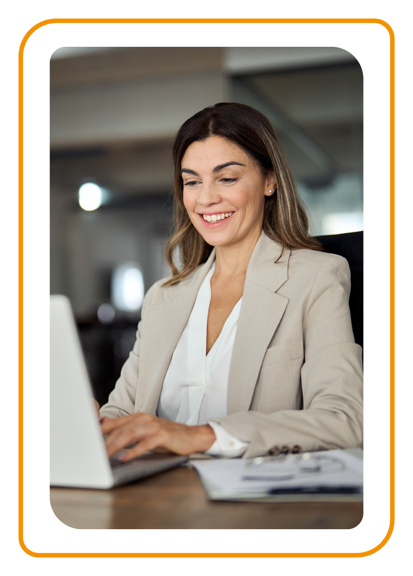 Woman in office using laptop at work