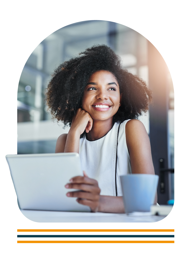 Portrait of a woman sat at a desk using a laptop