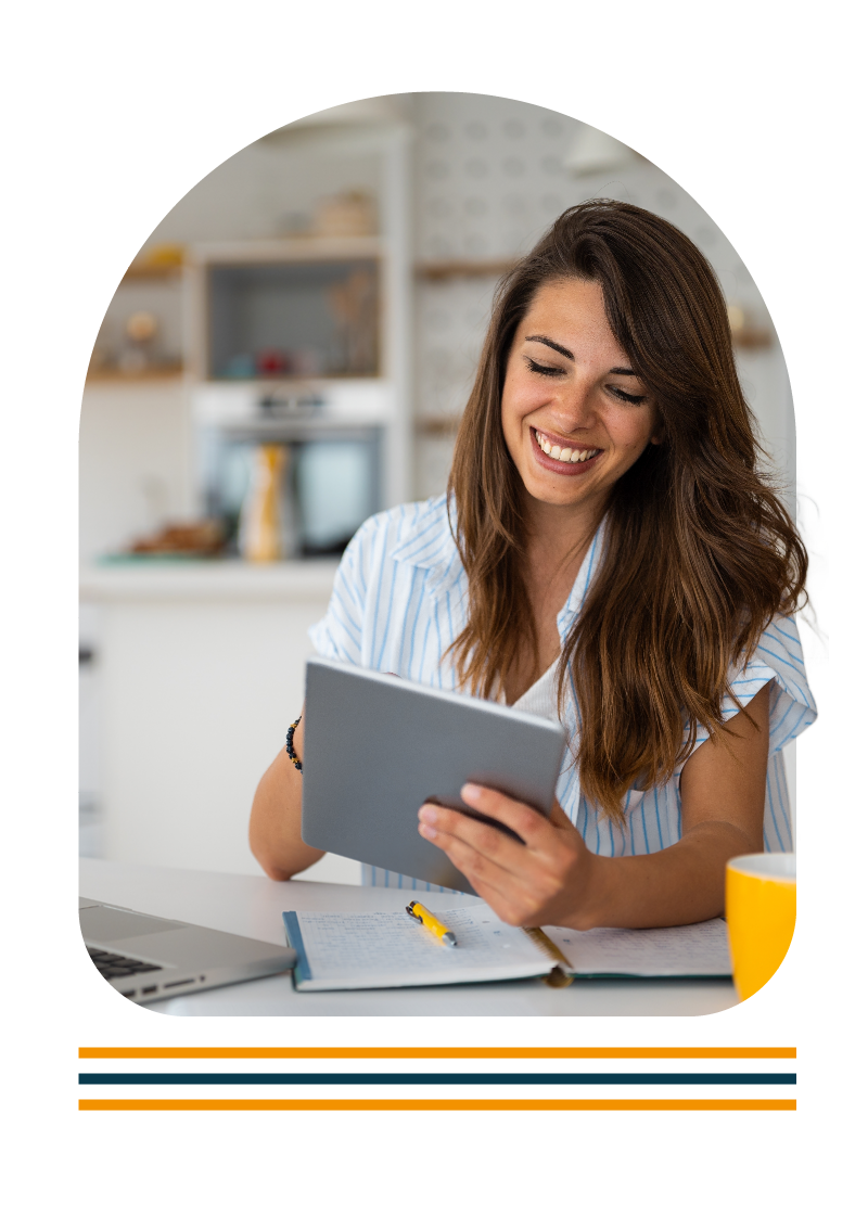 Women smiling while using a tablet device