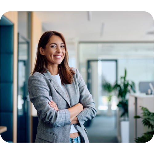 business person smiling at camera in light open space office