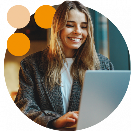 Woman working on a laptop smiling