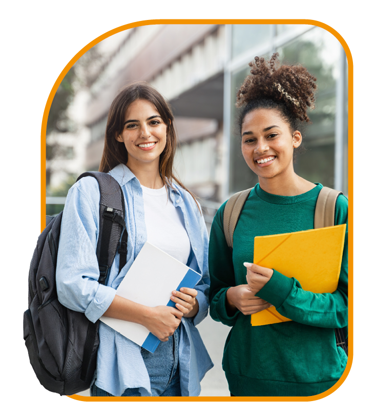 Two students smiling at camera while holding document folders